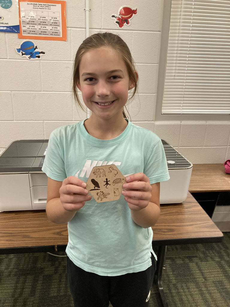 Pictured here is Lab Cats club member Callie Reed with the coaster she designed and created on the Florence Elementary Glowforge laser engraver. Awesome job Callie!!!  #GoFloCats 💚💛